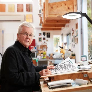Born in 1940, Vivienne Binns grew to be a key figure and influence in the Women’s Art Movement (WAM). 
Her compelling artworks and advocacy, notably aided in the establishment of the Woman’s Art Register, a living archive of women’s art practice, and is further credited with developing community arts in Australia. 
Vivienne’s iconic projects in the 1970s and 1980s aimed to increase public engagement with creativity, since then Binns has spent the last 30 years focused on addressing Australia’s cultural connections to the Asia-Pacific region with her painting practice. 
You can visit us and see her collaborative community work, ‘Mothers’ Memories, Others’ Memories’, on display until 13 September! 
We gratefully acknowledge the Blacktown Arts and Crafts Group for their support and key role in co-facilitating Mothers’ Memories, Others’ Memories. 
Read more via our link in bio. 
@blacktowncitycouncil @creatensw 
#BlacktownArts #BlacktownCityCouncil #VivienneBinns #Bio #Pioneer #WomensArt  --- 
Image: Vivienne Binns in her studio, 2021, photography by Zan Wimberley  ID: Showcases artist, Vivienne Binns, at a desk with an artwork in hand and looking into the camera