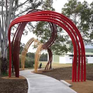Join us this Saturday 11 October in celebration of the opening of ‘Timeflows’ and Blacktown City Council’s new Disability Sports Centre!  The $15 million dollar facility will officially open and transform access for people with disability to grassroots sport and community participation.  The Sports Park precinct has also been enhanced through a $400,000 grant from the NSW Department of Planning and Environment to support the installation of ‘Timeflows’, a public artwork by local Dharug artist Shay Tobin, Chris Fox and Michael Cohen.  It reflects the deep connection between people, place and time on Dharug Country (Ngurra).  Free to attend
Blacktown International Sports Park
From 2.00 pm with official proceedings at 2.30 pm  Find more info about the artwork on our website, link in bio.  @blacktowncitycouncil @citypeoplesydney @shaytobinart @studiochrisfox @foxyalot  #BlacktownArts #BlacktownCityCouncil #CityPeople #BlacktownDisabilitySportsCentre #Opening  —
Images: Image 1 and 2, Blacktown Disability Sports Centre, courtesy of Blacktown City Council. Image 3, Artwork by Shay Tobin, Michael Cohen and Chris Fox, Timeflows, 2025, photo by Shay Tobin
ID: Image 1, shows a public park with a large constructed piece of public art, ‘Timeflows’, standing over a path, with kids riding bicycles on the path in the middle. Image 2, showcases the new Blacktown Disability Sports Centre with text reading ‘Blacktown Disability Sports Centre official opening and launch of Timeflows