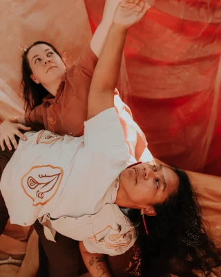 Get to know Amy Flannery and Aroha Pehi, performing at our opening of Ghosts in the Kitchen this Friday!  Amy is a First Nations Australian creator who has performed, choreographed, and composed for a number of companies and independent productions. 
Aroha is a proud Taribelang-Bunda, Kuku-Yalanji, Ngāpuhi and Ngātiporou woman from South-East Queensland, currently focused on her Emerging Producer Internship with Bangarra Dance Theatre.  They’re responding to the exhibition with family stories woven with dance and sounds from friends’ kitchens.  The night will also feature performances by: 
Sonya Holowell and JWPaton 
Lucy Norton and Anne-Marie Te Whiu  Exhibition guest curated by Rebecca Ray 
Performance program curated by Verónica Barac-Gomez  Find the full program via our website! 
Free to attend with registrations.  @blacktowncitycouncil @creatensw @yrennalfyma @aroha.pehi @brekkyyy  #BlacktownArts #BlacktownCityCouncil #GhostsintheKitchen #Opening #Performances  --- 
Images: Image 1, Amy Flannery and Aroha Pehi, courtesy of artists. Image 2, Amy Flannery, photo by TeeClick. Image 3, Aroha Pehi, courtesy of artist  ID: Image 1, shows 2 women in a earth tone colour space, with 1 person (Aroha Pehi), laying and leaning over person 2 (Amy Flannery) as they both point one arm up towards the sky