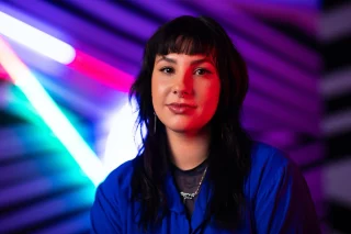 Get to know our guest curator, Rebecca Ray.  An experienced Meriam curator and writer, she joined us to curate the new ‘Ghosts in the Kitchen’ exhibition.  Rebecca lives and works on Gadigal land, her practice focuses on the reindigenisation, rematriation and the reclamation of sovereign spaces.  Visit us to learn more about Rebecca and the exhibition!  @blacktowncitycouncil @creatensw @brekkyyy  #BlacktownArts #BlacktownCityCouncil #GhostsintheKitchen #Exhibtion #RebeccaRay #Free 
---  Image: Rebecca Ray, 2025, courtesy of MCA 
ID: Image shows Rebecca Ray sitting in a darkly lit, purple coloured space, whilst smiling and looking at the camera