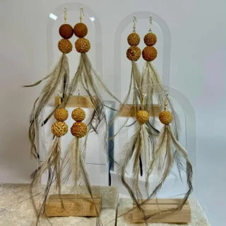 Enjoy jewellery and clothing inspired by vibrant Pasifika cultures at Maketi Moana: Pasifika Makers Markets.  Marruy Designs is led by proud Wonnarua woman, Jenni Bolluck, a dedicated high school teacher and contemporary artist that creates vibrant works. Jenni’s paintings inspire beautiful jewellery and homewares, blending traditional materials with modern techniques.  Moemiti Designs is run by Timena as way to stay creative. Infusing the love of vintage and re-imagining traditional Polynesian design to create jewellery and clothing. Their products are Pacific-inspired and showcase the diversity of Pasifika cultures.  Keep a look out for the full line-up, coming soon!  Learn more via our website, link in bio.  @blacktowncitycouncil @powerhouse @maketi_moana @MarruyDesigns @moemitidesigns  #BlacktownArts #BlacktownCityCouncil #WesternSydneyFashionFestival #Fashion #Markets  Images:  Image 1, Marruy Designs, courtesy of artist. Image 2, Moemiti Designs, courtesy of artist  ID: Image 1 shows a pair of handmade earrings with feathers. Image 2 shows a silver pair of earrings that are designed with text reading 'Alofa'